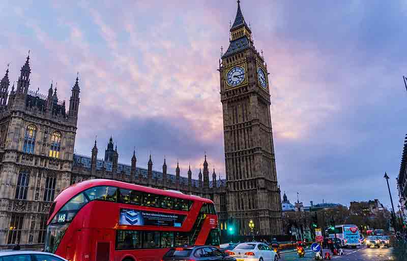 Houses of Parliament with Beg Ben and red London Bus.