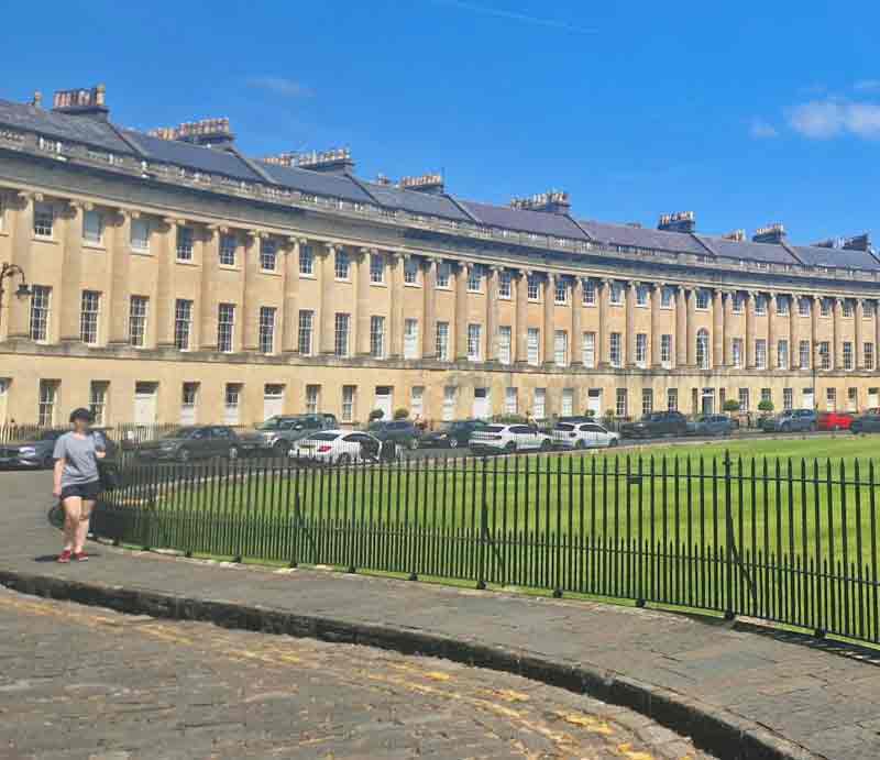 The Georgian architecture looking across the grass.